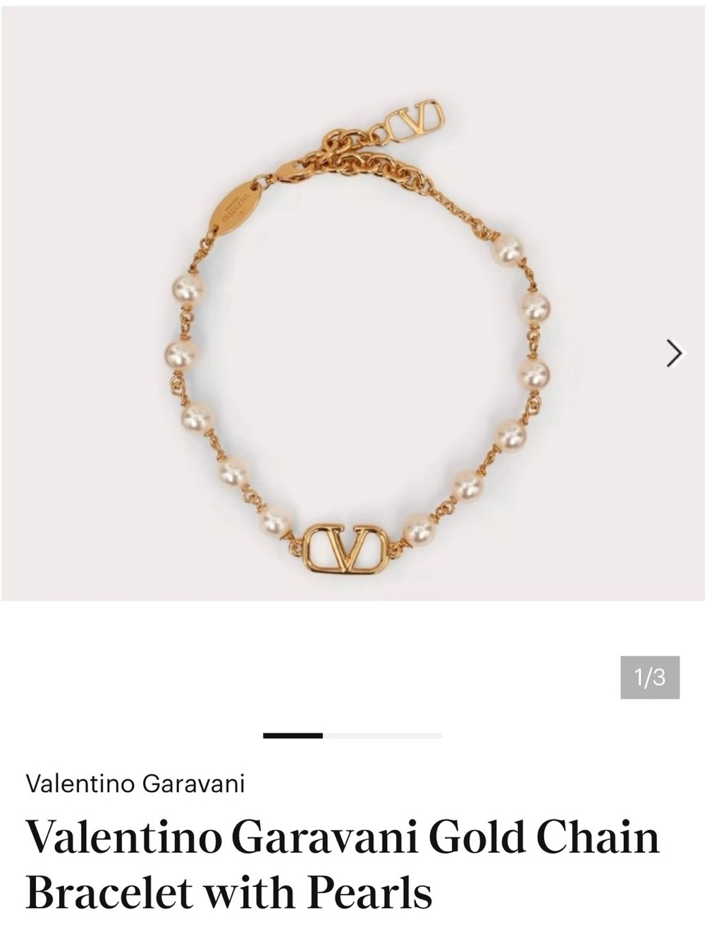 Gold and pearl designer bracelet used
